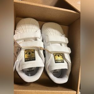 Adidas. New in box. Size 4 soft bottoms.